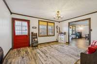 Front door, living room and opening to the family room.
