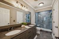 Remodeled bathroom with dual vanity and walk in shower.