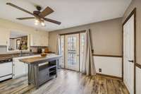Kitchen with door to backyard and wrap around porch.