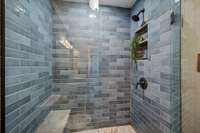 Walk in shower with bench.