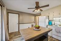 Kitchen and door to half bathroom.