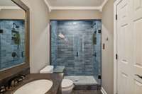 Walk in shower with bench.