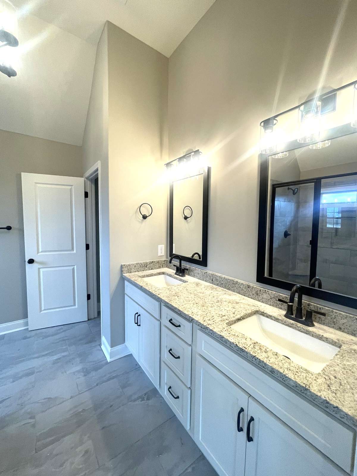 Owners Suite Comfort Height Cabinets Highlighted with Granite Tops....