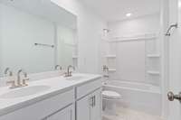 Bathroom 2 with double bowl sinks
(photo is of a finished similar home- options and colors may vary in actual home)