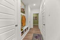 Entry from garage and Laundry Room
(photo is from a furnished model home in a different state- finishes and options will vary. See sales consultant for details for actual home)