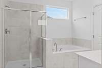 Tile shower and soaking tub
(photo is of a finished similar home- options and colors may vary in actual home)