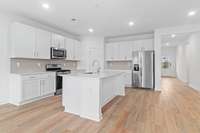 Kitchen
(photo is of a finished similar home- options and colors may vary in actual home)