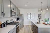 This is a photo of one of our model homes. Please know that some of the exterior and interior finishes, paint, and features may vary.