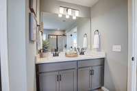 This is a photo of one of our model homes. Please know that some of the exterior and interior finishes, paint, and features may vary.