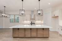 Open concept kitchen with large 8' Island that easily seats 6.