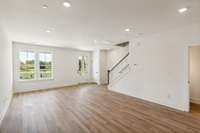 Another view of your open living room. Clean, modern, and spacious-- why should your home be anything else? Actual photo of home.