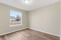 Bedroom 3, the first room on the right, features a large window, spacious layout, and a generous closet—ideal for a guest room, office, or personal retreat.