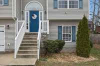 Inviting entry with stair access to both the main living level and finished lower level, creating a practical split level layout.