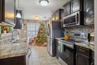 Functional kitchen layout offering plenty of cabinet storage and countertop space.