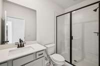 ***Photo from previously built home - options and colors may vary***

A full Bathroom with a tiled walk-in shower is included on the 1st floor just off of the Guest Retreat.