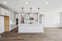 ***Photo from previously built home - options and colors may vary***

Enjoying cooking in this beautiful Gourmet Kitchen!