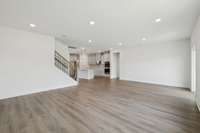 The generously sized great room offers an open-concept design and large windows allowing for plenty of natural light. This versatile layout is ideal for both entertaining and everyday living.