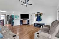 Living Room with view into Primary bedroom to the right & dining/kitchen