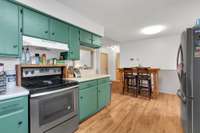 Freshly painted cabinets & stainless steel appliances