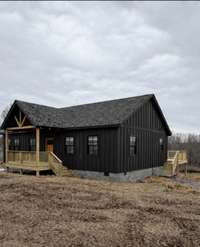 Black siding will be on the home soon. This is a picture for reference only. This sleek stylish home outshines other new builds.