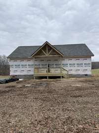 Siding and windows coming soon. The level yard to the home is a plus !