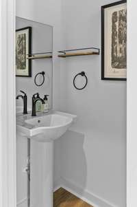 Photos of similar listing - home is under construction. 1/2 bathroom convenient for guests downstairs!