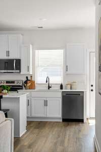 Photos of similar listing - home is under construction. Luxury Vinyl flooring throughout main level!