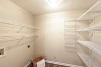 Spacious laundry room with extra storage provides functionality and organization without sacrificing style.