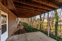 Multiple outdoor areas provide options for dining, lounging, or enjoying nature in privacy.