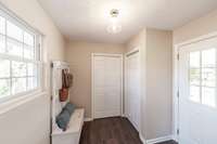 Convenient drop zone area just inside the carport entry offers the perfect place for bags, shoes, and everyday essentials.