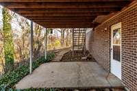 Walkout basement patio provides a private retreat, ideal for a swing or cozy seating area.