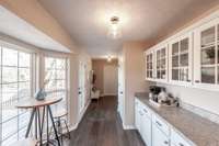 The eat-in area offers a comfortable spot for casual meals, morning coffee, or gathering with family.