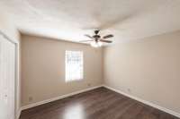 Comfortable main-level guest bedroom offering a bright, welcoming space for visitors or everyday use.