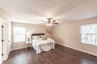 Spacious and serene primary suite offering plenty of room for a king-size bed and additional furniture.