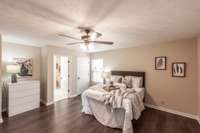 The generous layout creates a relaxing retreat with flexible options for seating or a reading nook.