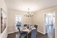 The dining area is ideally positioned just off the kitchen, making hosting meals and gatherings effortless.