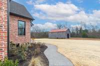 Sidewalk snakes around home to the patio