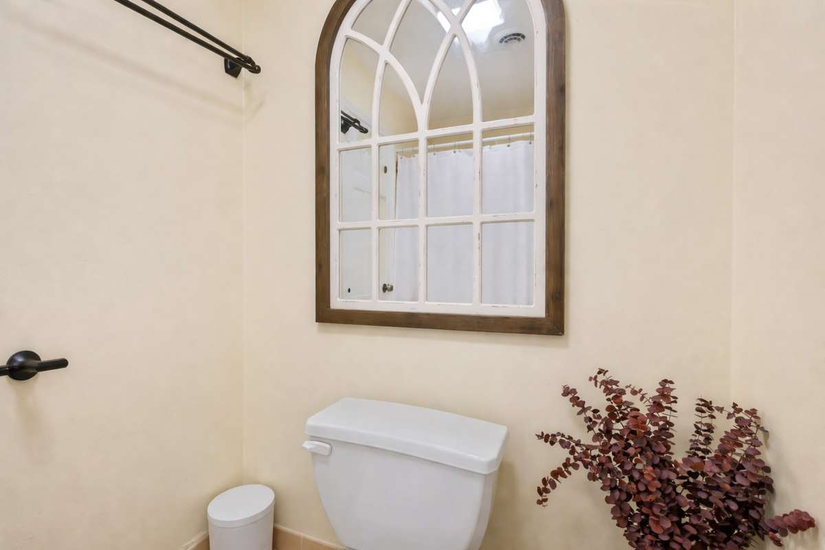 Primary Bathroom (Shower Area) – Separate area includes a shower/tub combination and additional space for privacy and convenience, with a simple, easy-care layout.