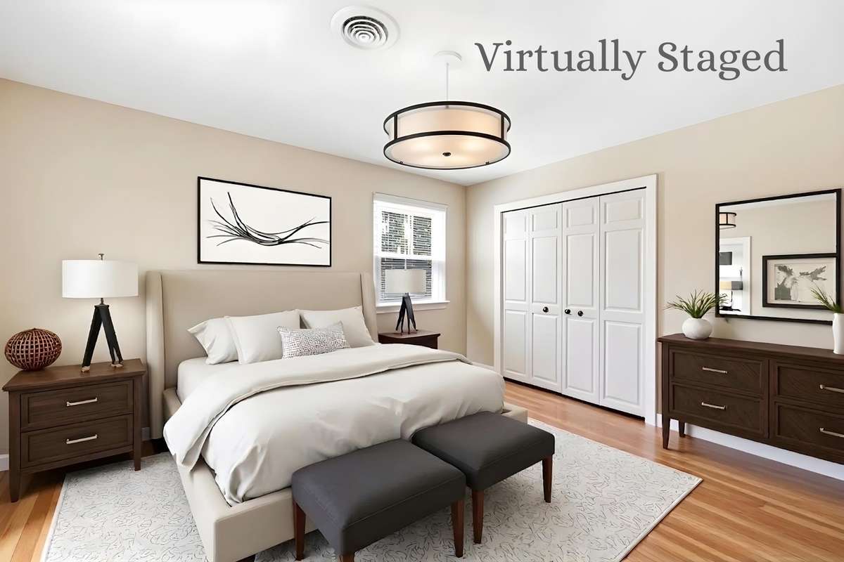 Bedroom (Virtually Staged) – Bright bedroom with hardwood flooring, neutral tones, and a spacious closet. Shown staged to highlight layout and potential for a comfortable retreat.