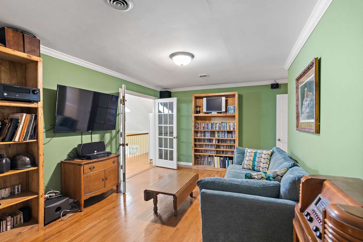 Bonus Room (Alternate View) – Versatile space ideal for a media room, office, or potential 4th bedroom, featuring ample wall space, natural light, and an easy flow to adjacent living areas.
