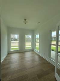 Dedicated main level home office with glass french doors
Previously built home, options and selections may vary