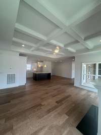 Beautiful open living/dining/kitchen layout with a coffered detail ceiling
Previously built home, options and selections may vary