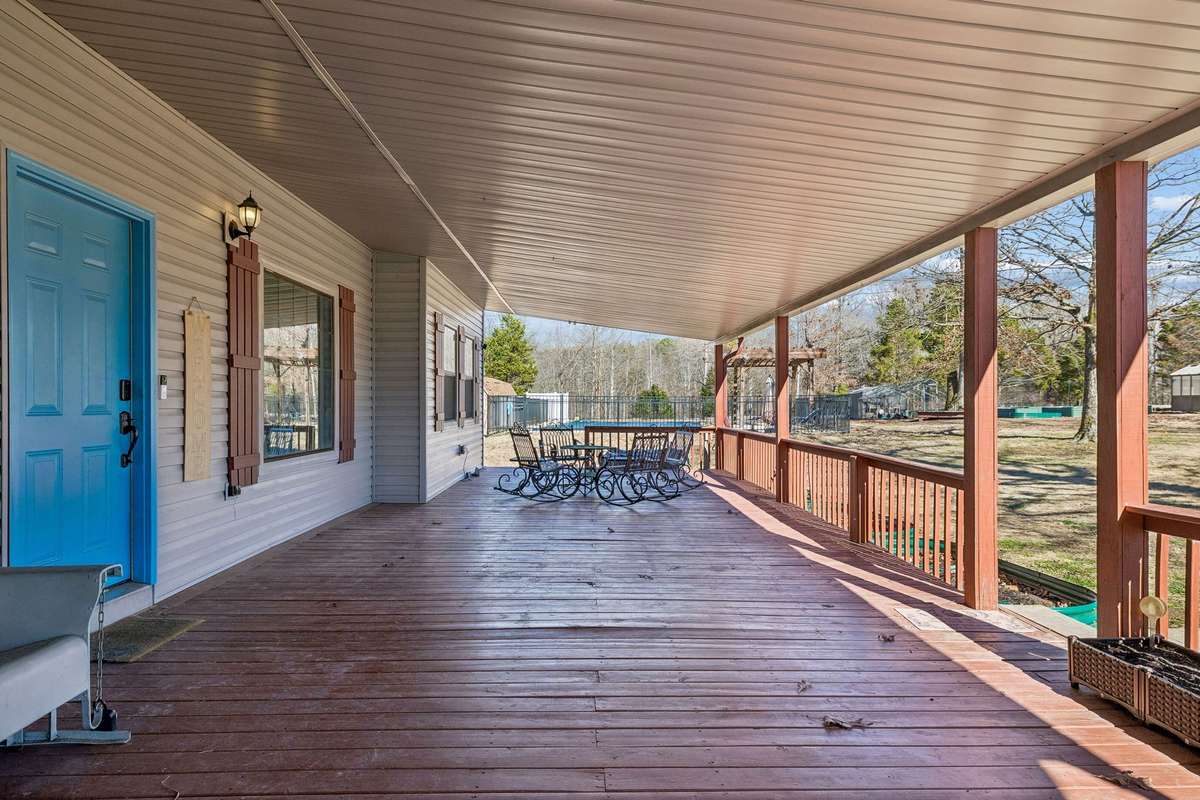 Enjoy space for outdoor meals, relaxing and listening to the rain, and more on the veranda.