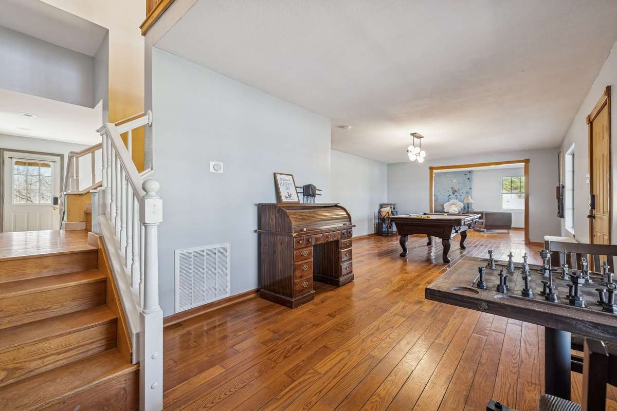 This space as you walk in is the perfect formal living room/dining room, or game space for the whole family.