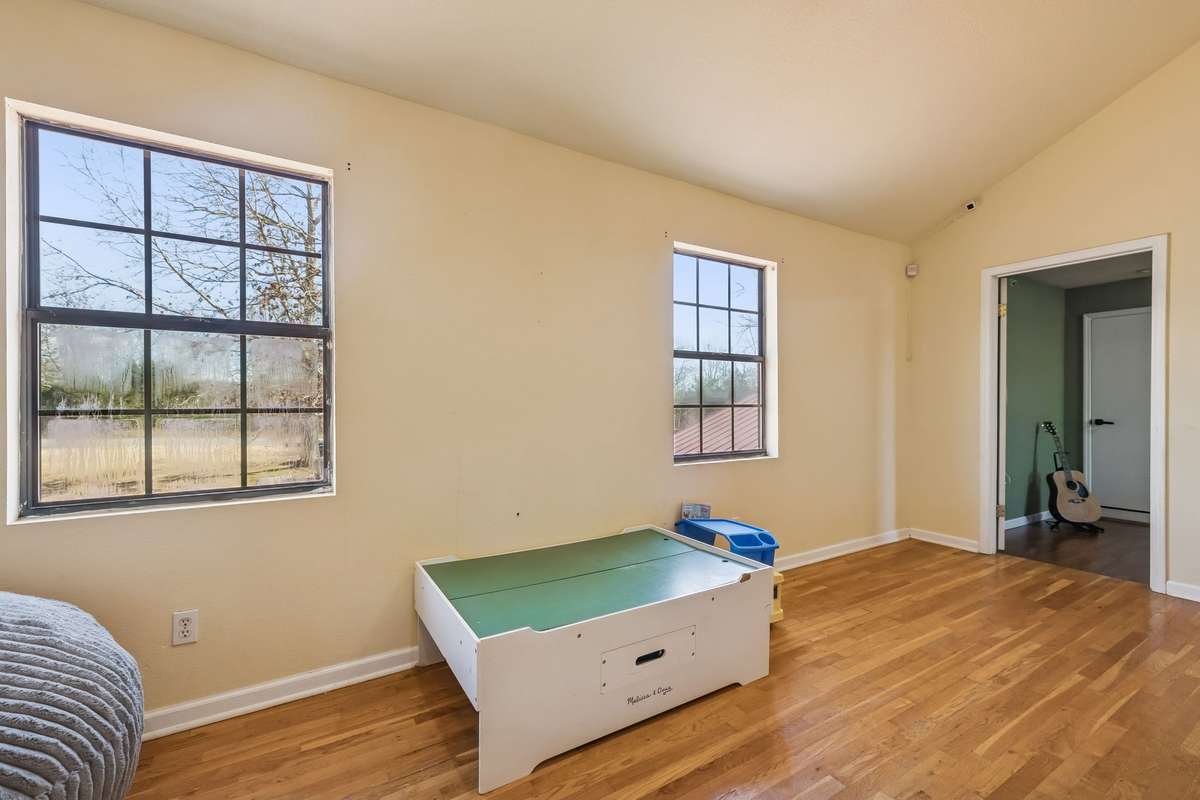 The loft (currently a kid's play area) offers space for lots of options--a home office, more secluded family area, kids play area, or more.