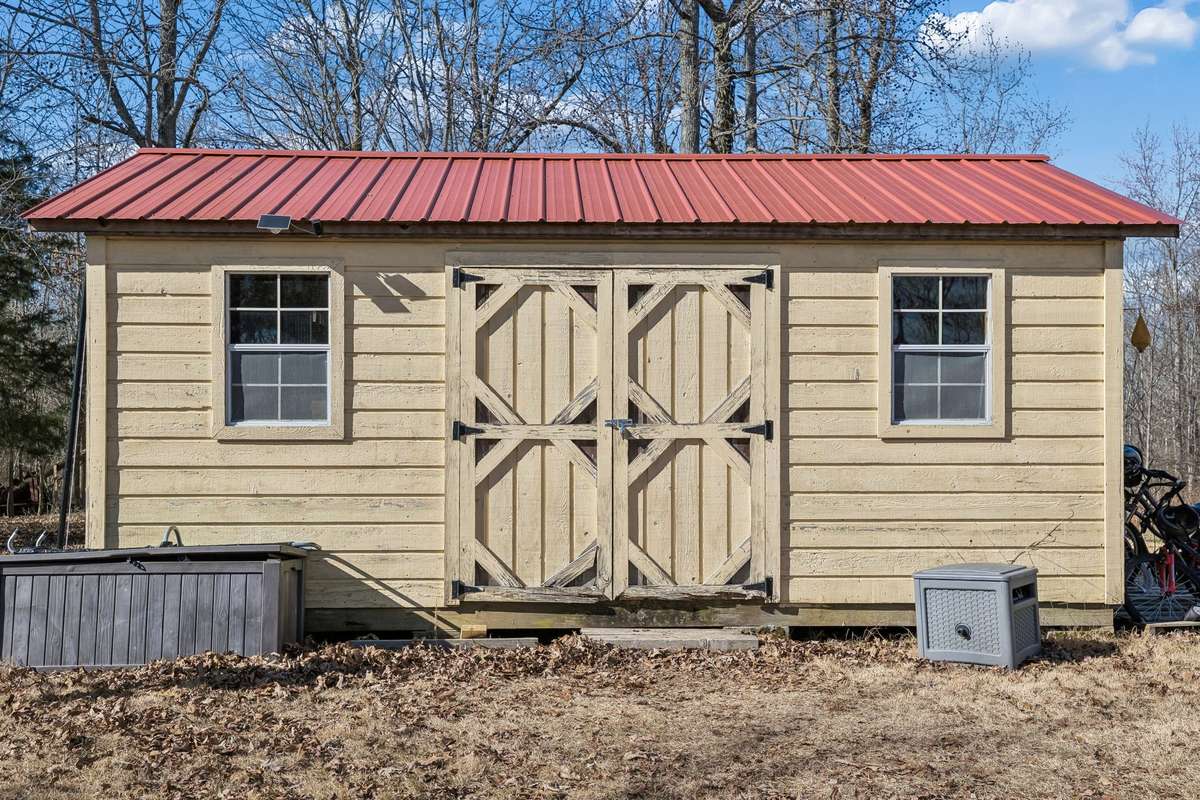 This is one of 4 outbuildings offered on the space--perfect for storage, hobbies, and more.