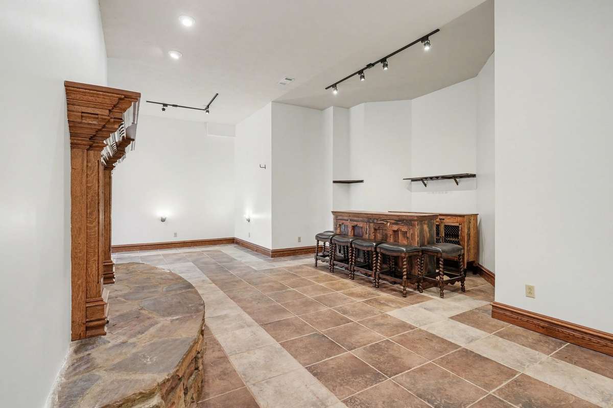 4000 sq ft basement with double sided fireplace and bar area