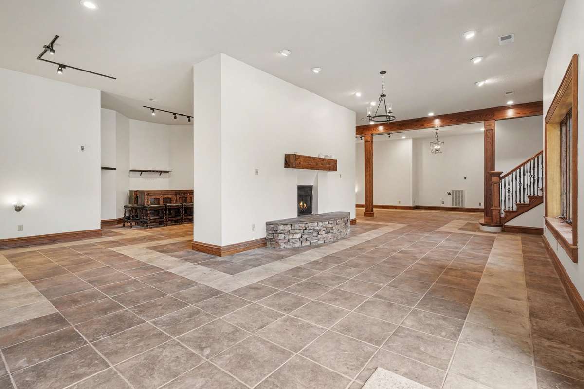 4000 sq ft basement with double sided fireplace and bar area