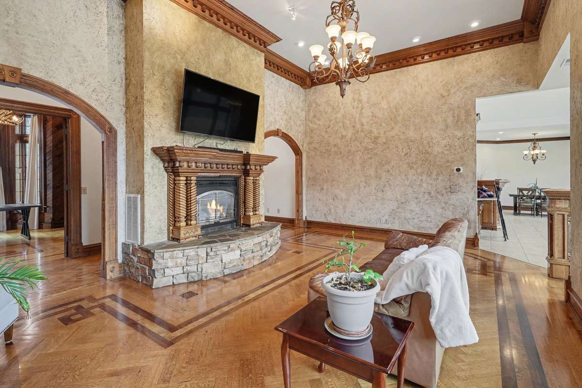 Living Room looking into foyer and eat in kitchen area with den