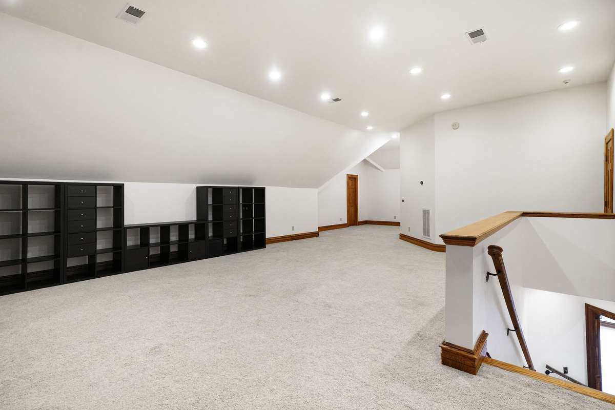 large bonus room upstairs. stairs to downstairs area.